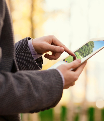 androginous person using tablet computer